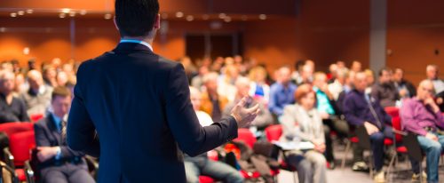 person speaking at a conference